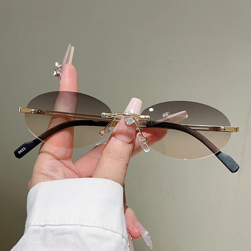 Rimless ovale zonnebrillen voo - Designer Sunglasses recensie en prijs